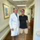 Larry Heath stands with Dr. Leone. Happy about his SPAIRE total hip.