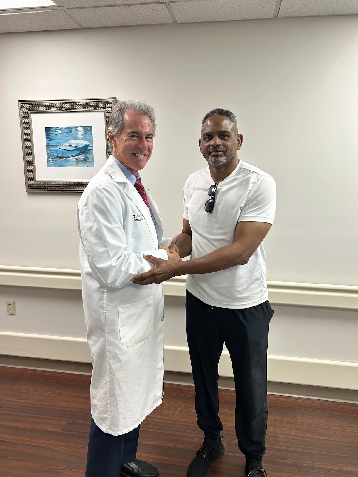 Albert Brown is shaking hands with Dr. Leone. Thanking him for a great knee.
